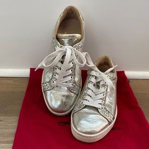 Christian Louboutin silver glitter sneakers.